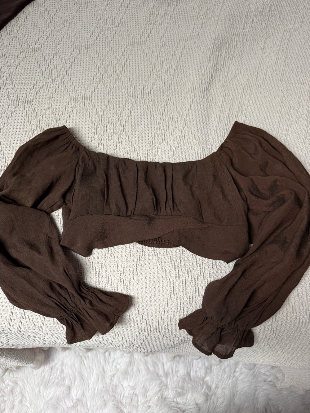 Brown ruffled cropped long sleeve top with tie back